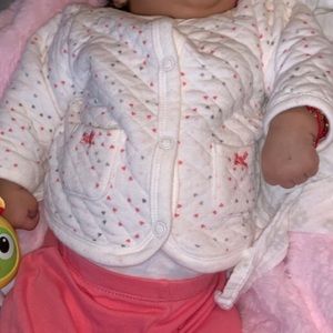 Pink hearted polkadot outfit.